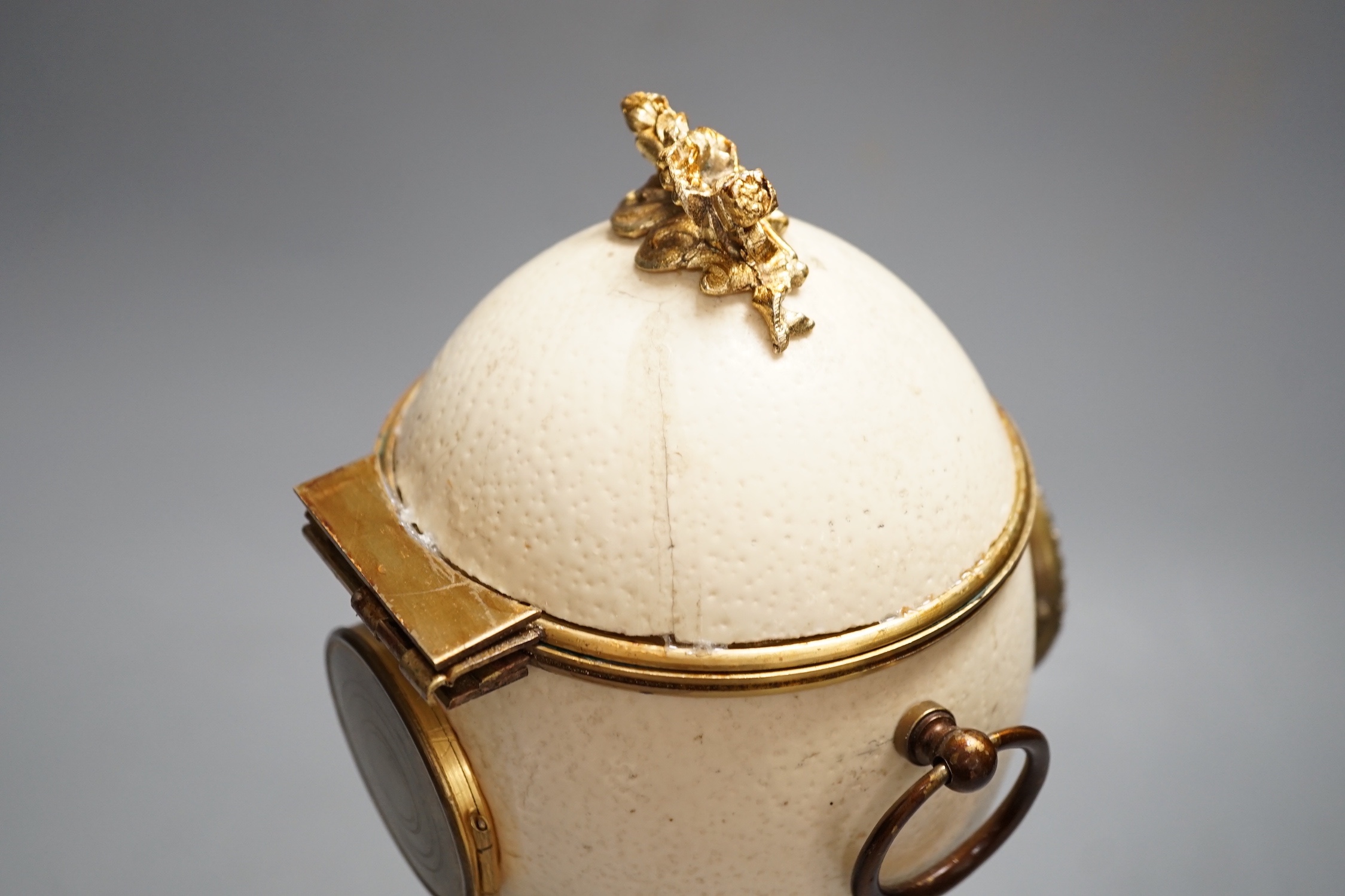 An unusual late 19th/early 20th century ostrich egg timepiece with encased compass and barometer - key included, 29cm high